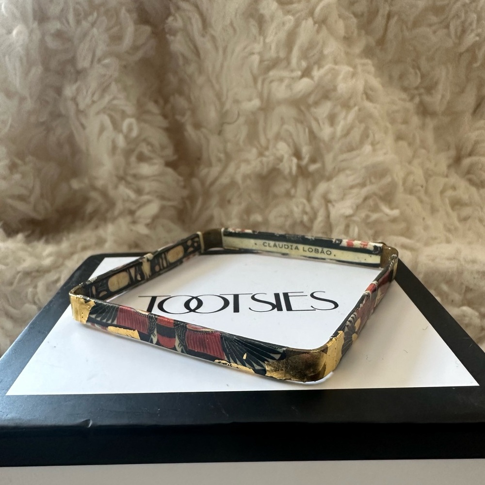 Tootsie Claudia Lobao square shape bangle. Gold red and black design.